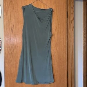 Mid length stretchy green dress, no sleeves.